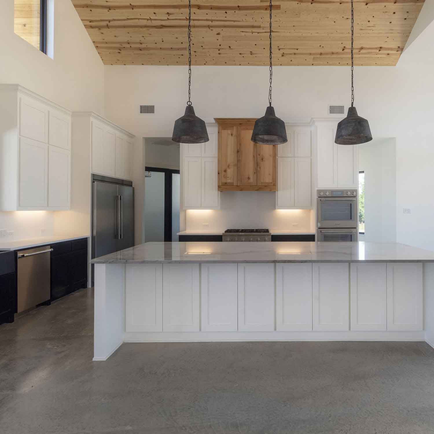 A Modern Kitchen With Polished Concrete Floors in Fort Worth, Texas.