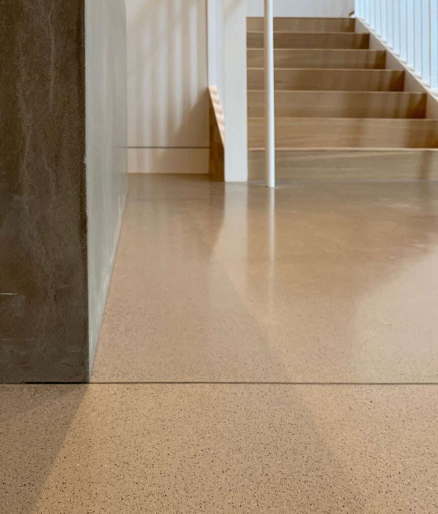 A polished concrete floor with a grouted saw cut line. These contrasting grout lines both accent the decorative cuts and eliminate cleaning issues.